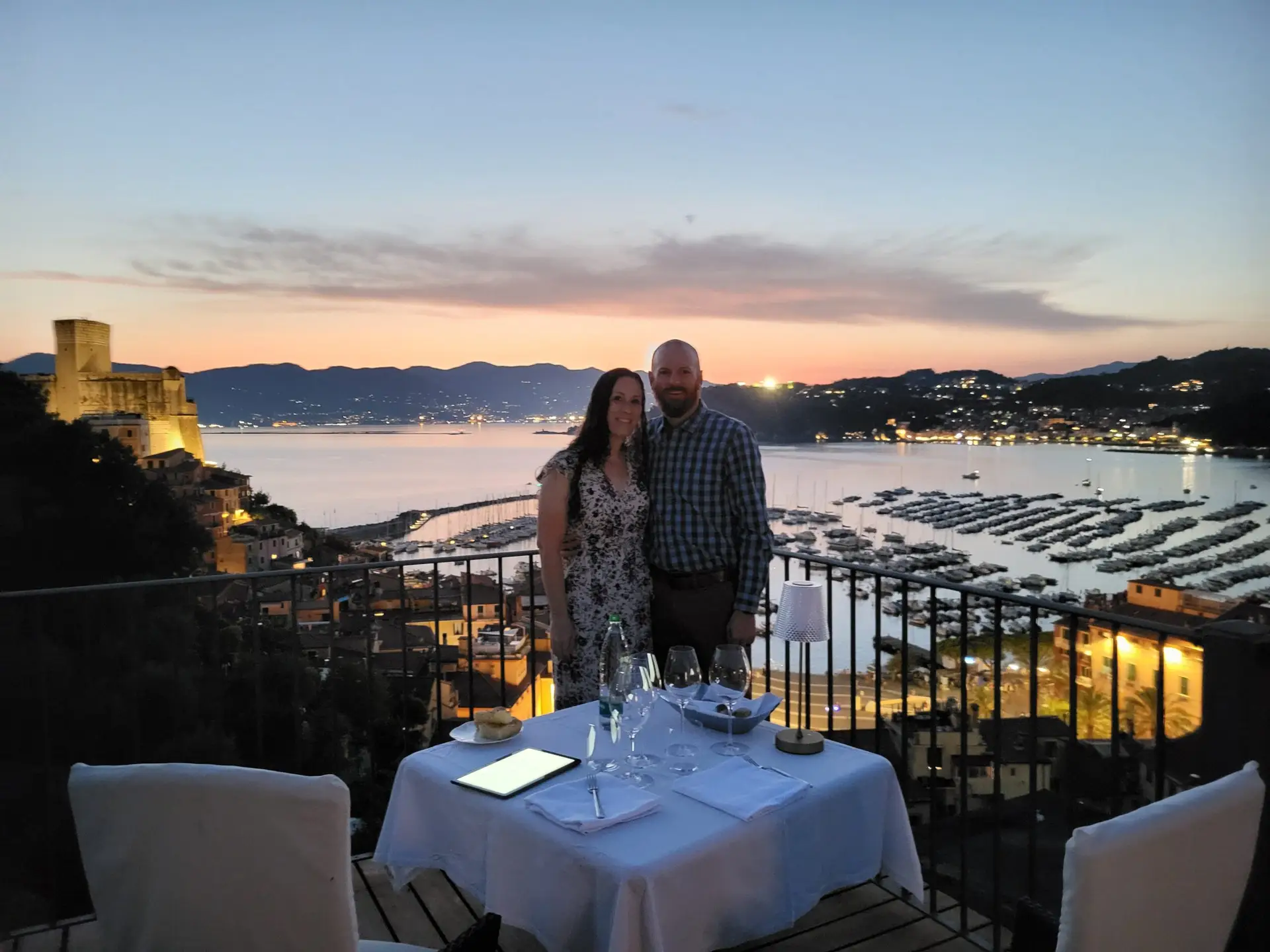 Sun going down view of couple overlooking Lerici, Italy