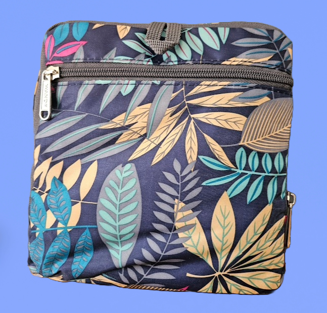 A foldable duffle bag, folded and compact with a blue green yellow feather design.