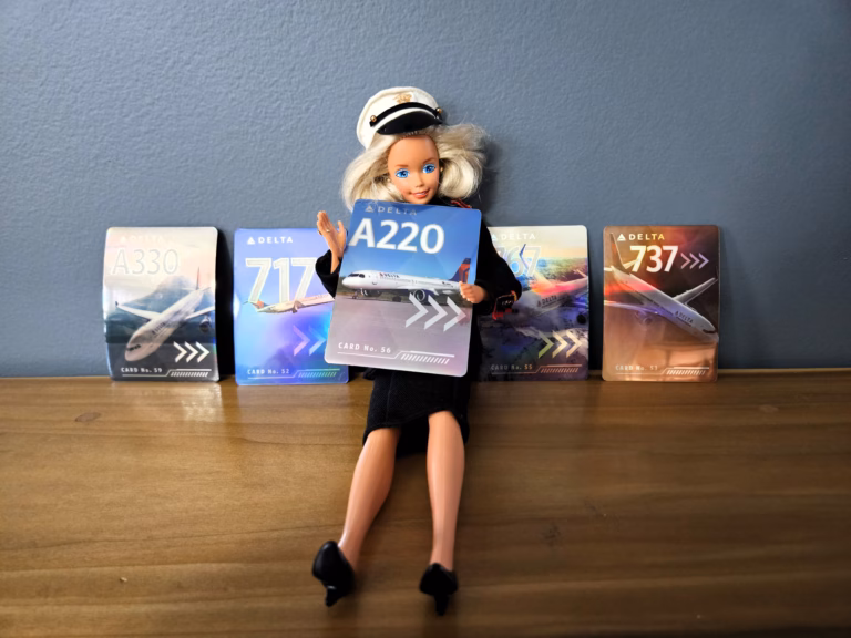 Delta Flight Attendant Barbie Doll with Delta flight cards.