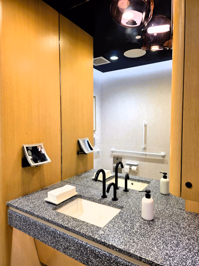 Modern bathroom inside Capital One Lounge at Denver Airport
