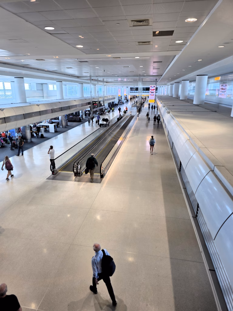View looking down to the DEN concourse from the Cap One Lounge