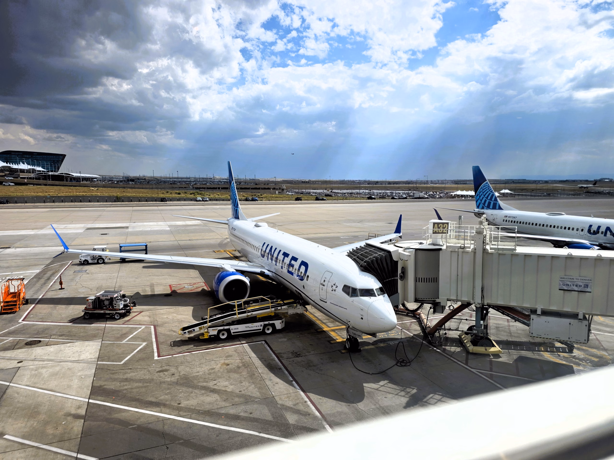 View of United aircraft parked at gates from Capital One Lounge windows at DEN