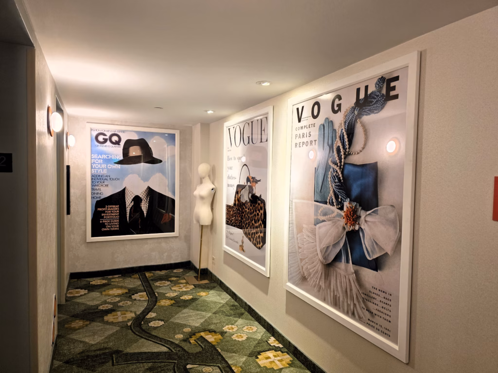 Elevator lobby with bold artwork on the You Better Werk themed twelfth floor at The Curtis, a Hilton Doubletree.