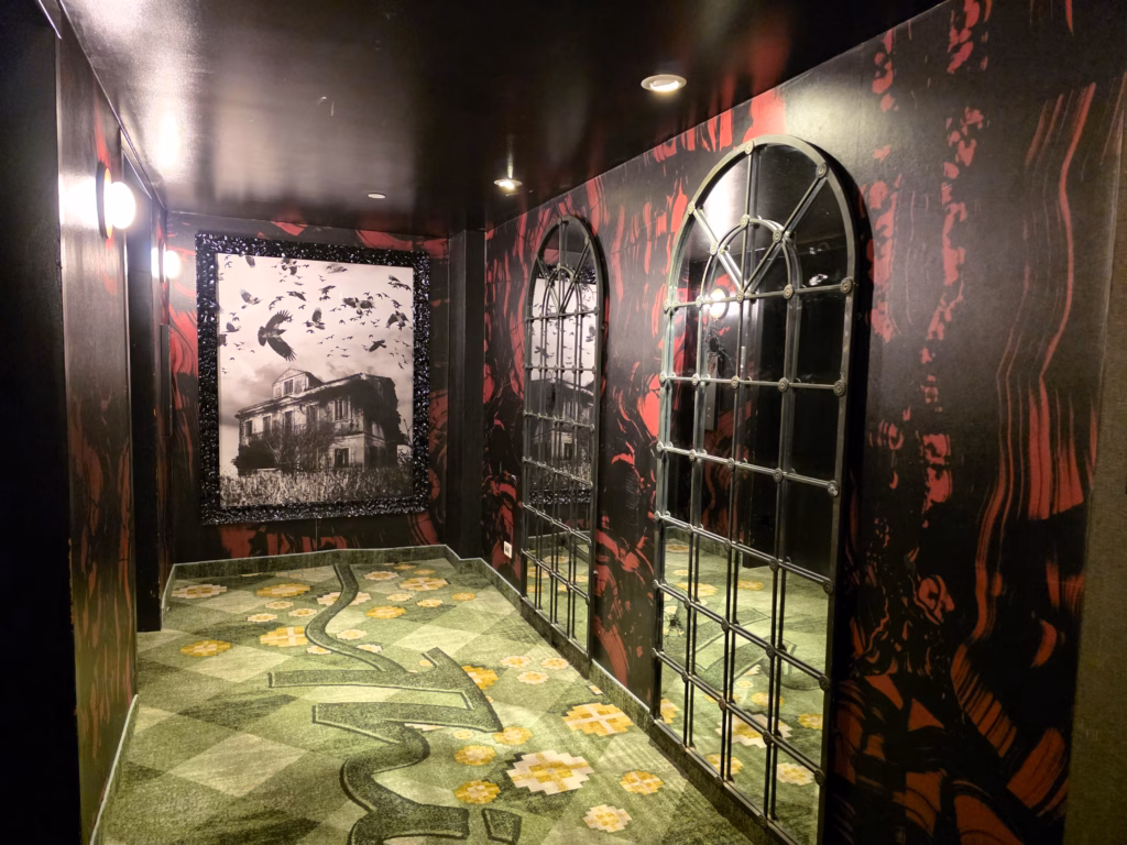 Elevator lobby decorated with horror-themed artwork at The Curtis Denver, 13th floor.