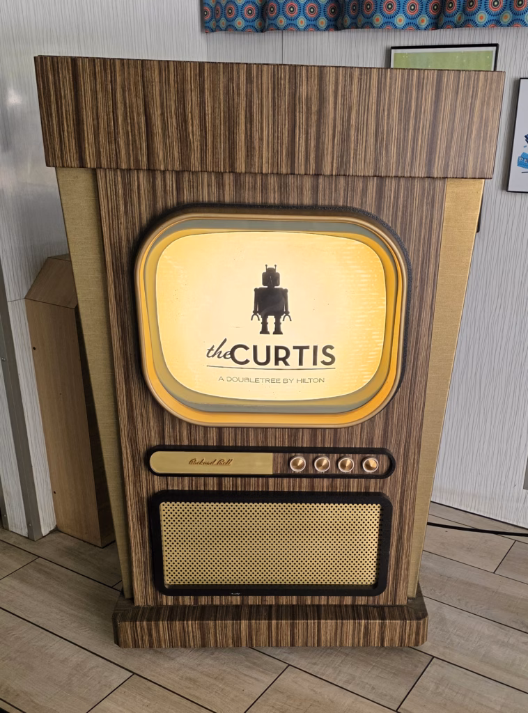 Inside the front doors at The Curtis Hotel Denver, colorful and playful with retro décor.