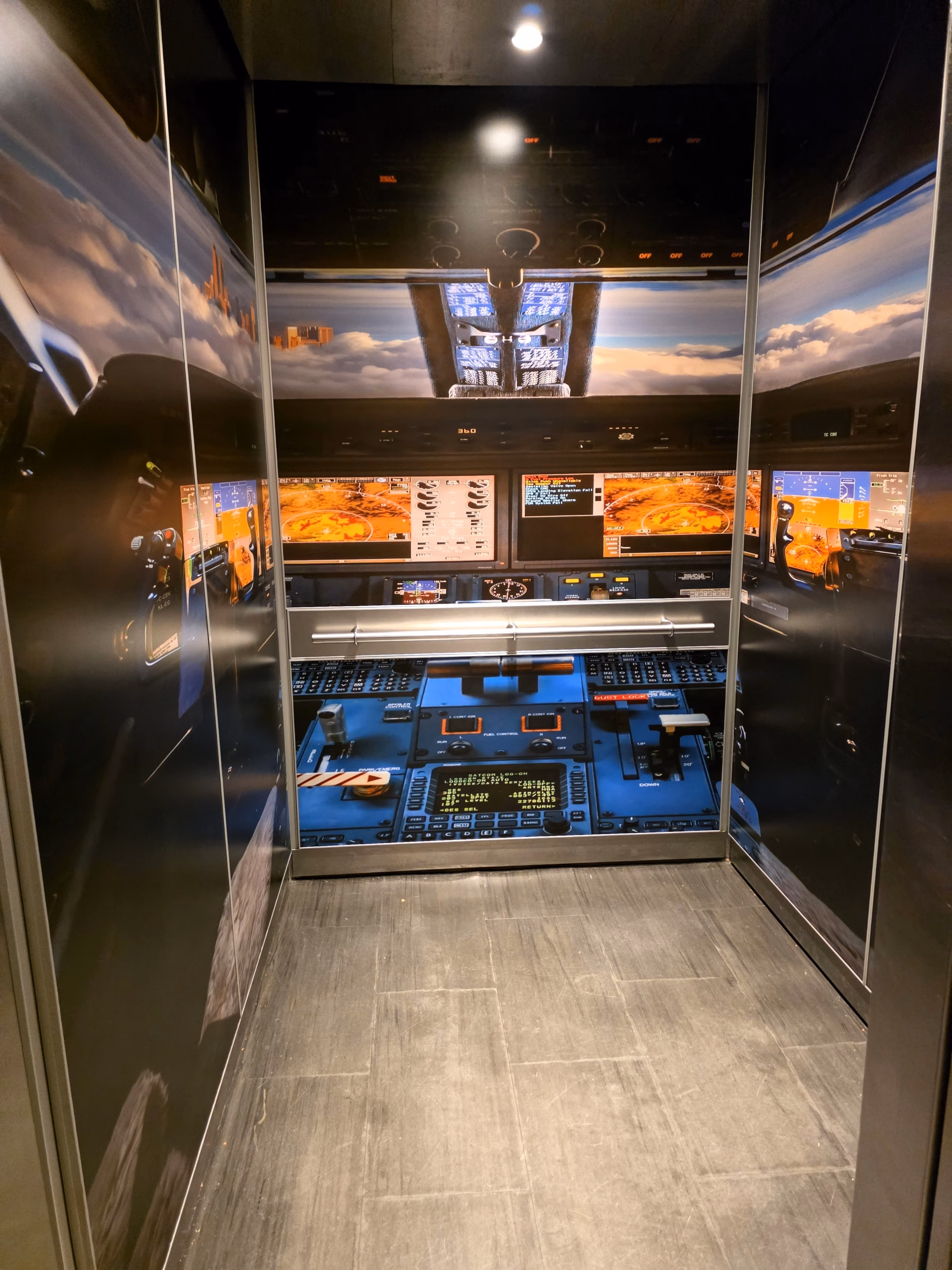 Colorfully themed fully wrapped elevator inside The Curtis Hotel in Denver.