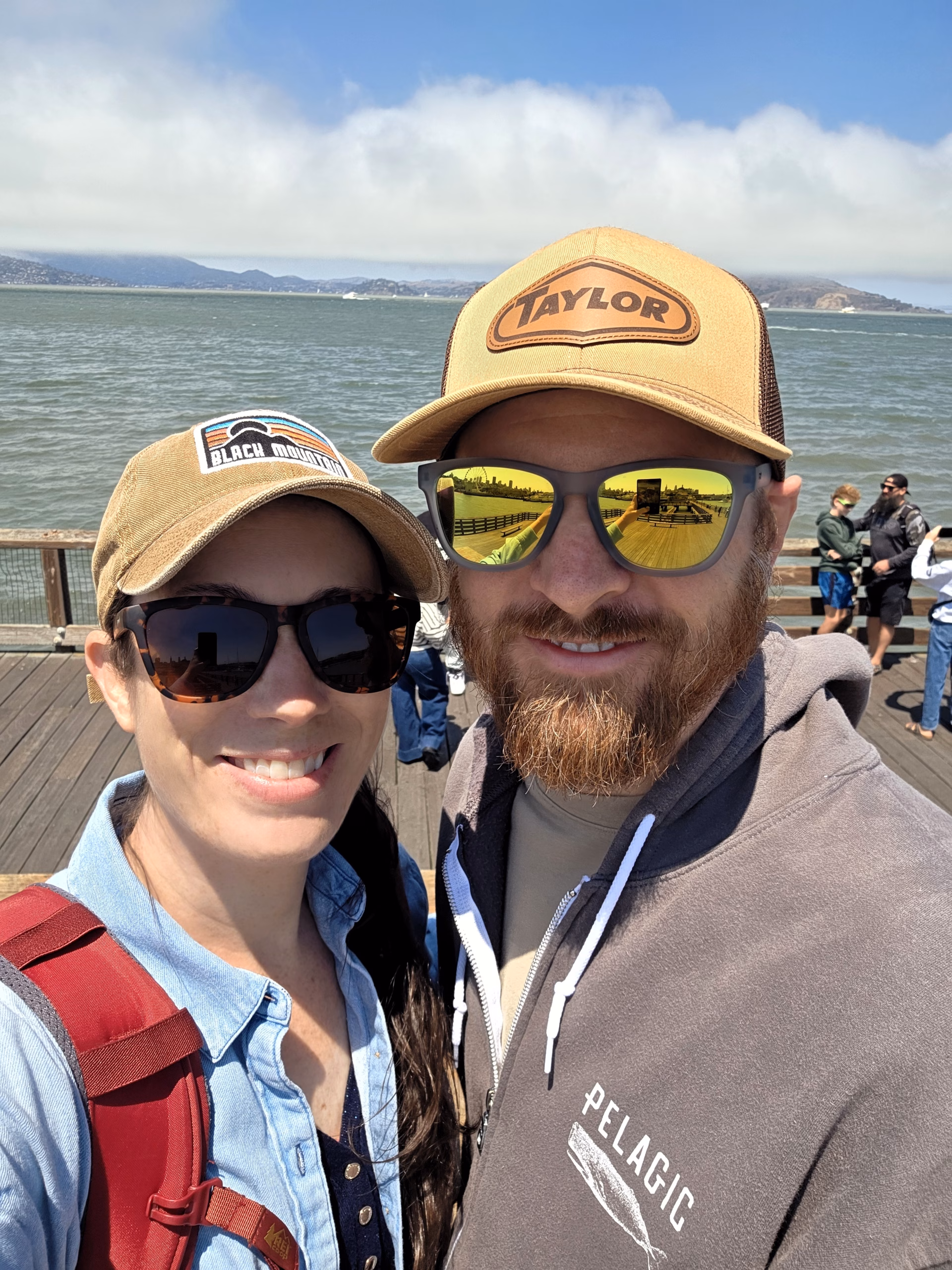 Couple-standing-in-front-of-water-in-San-Francisco-near-Pier-31