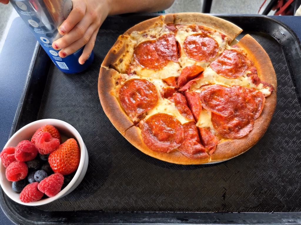 Pepperoni pizza and berry bowl from the Monterey Bay Aquarium Café lunch menu