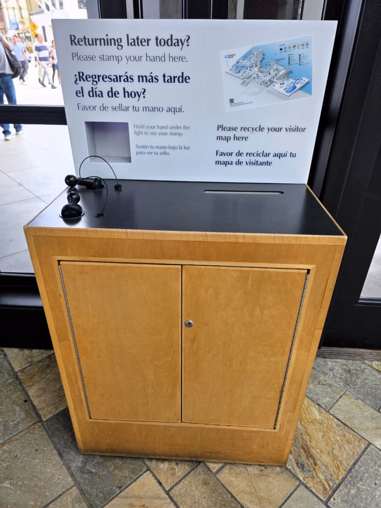 hand stamp table at monterey bay aquarium for leaving and returning