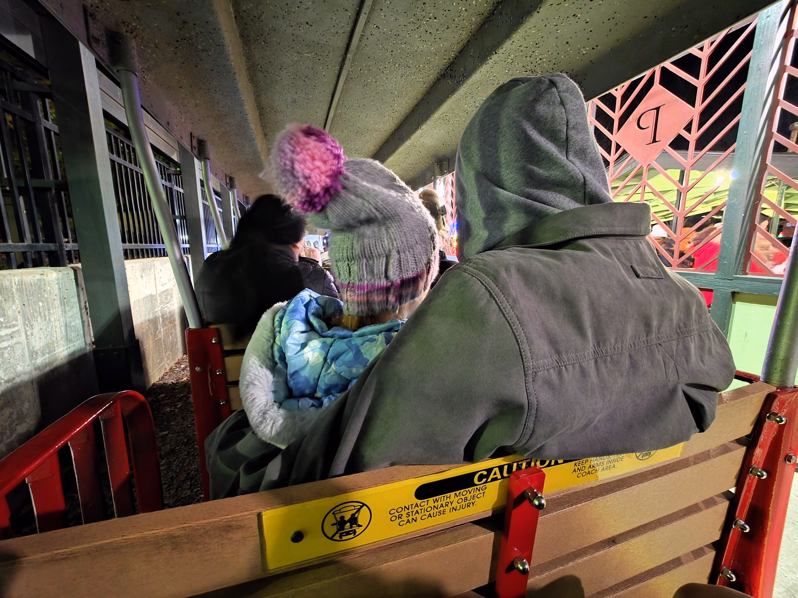 dad-daughter-ready-to-ride-pullen-park-holiday-express-train