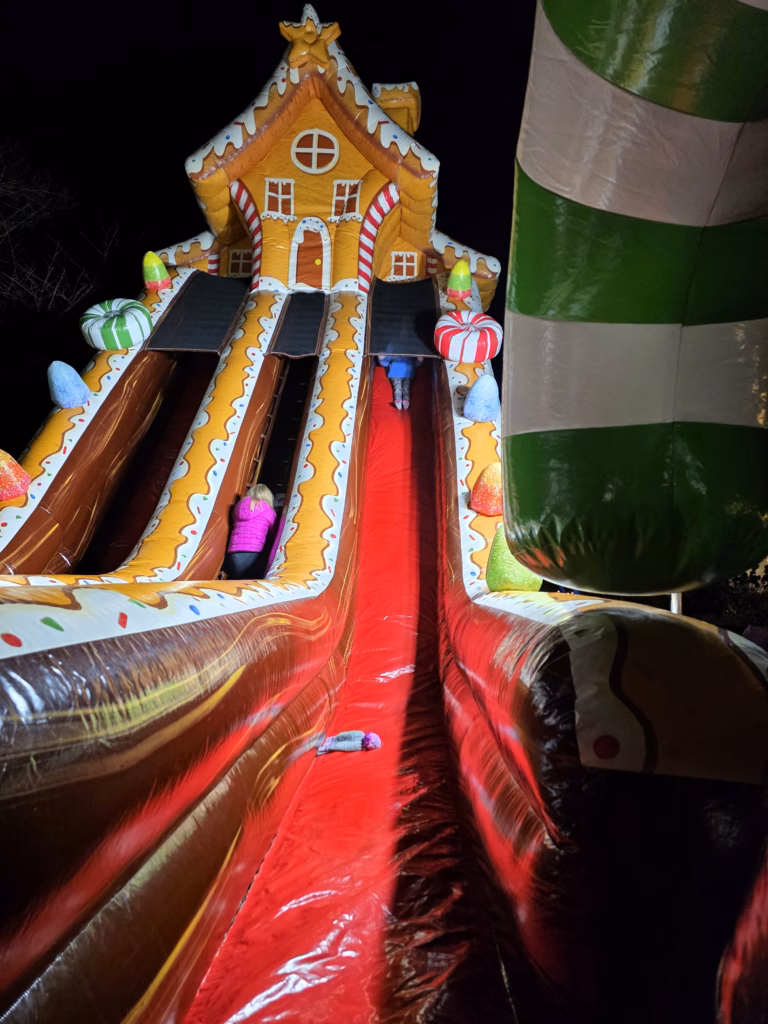 kids-sliding-on-huge-gingerbread-blowup-pullen-park-holiday-express