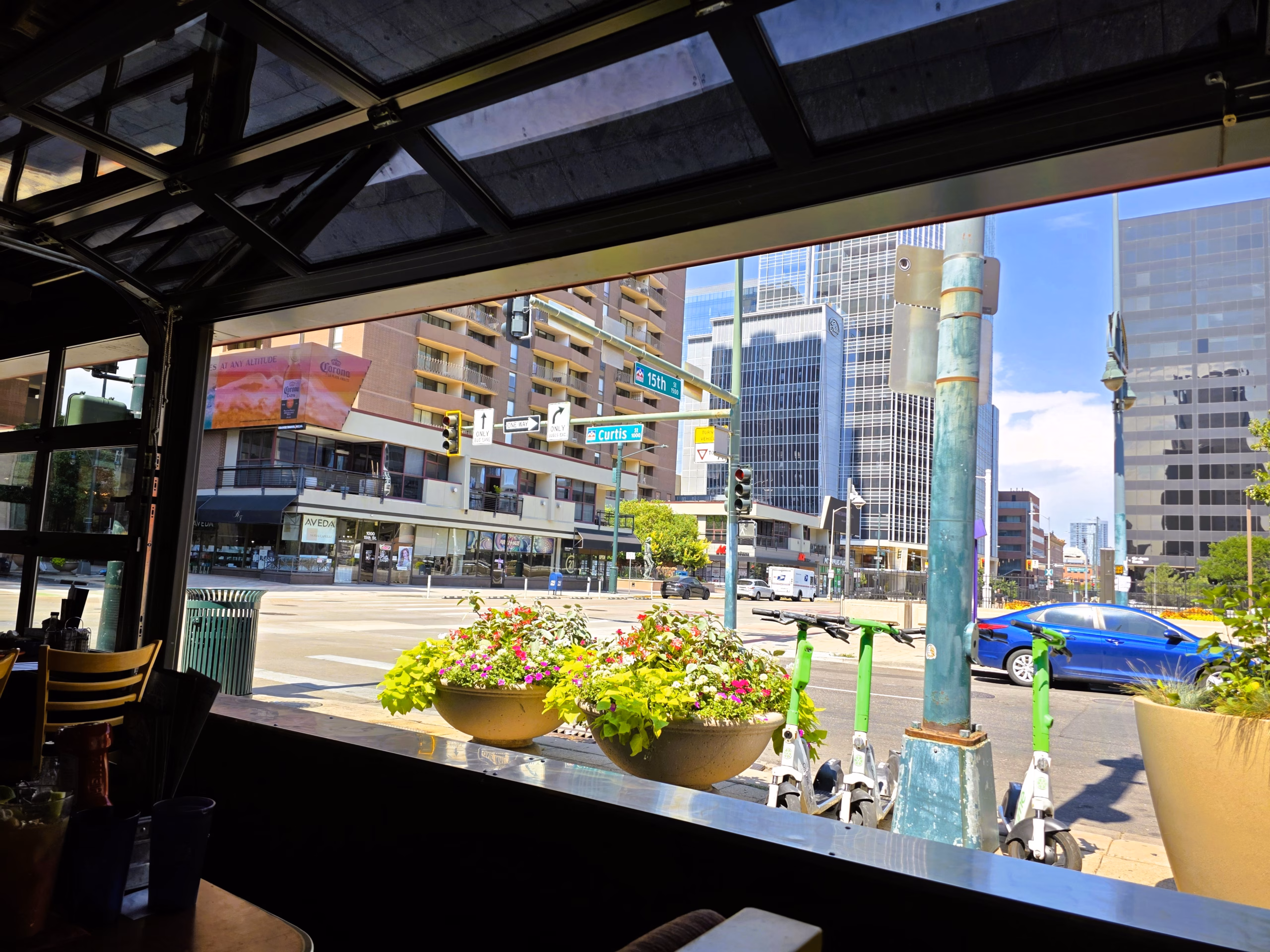 Outdoor seating at Sam’s #3 in downtown Denver with great view of city