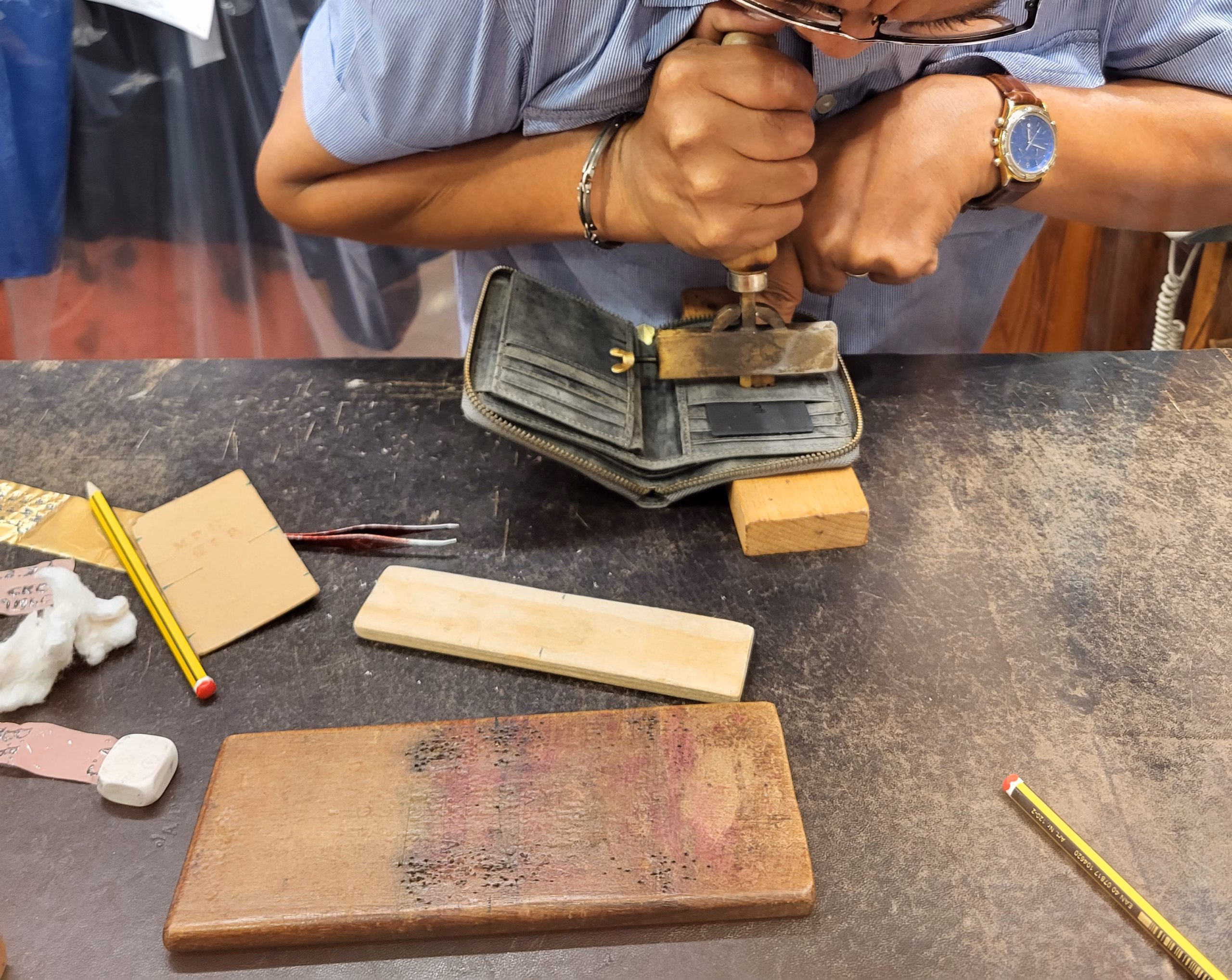 florence santa croce leather store engraving a leather wallet