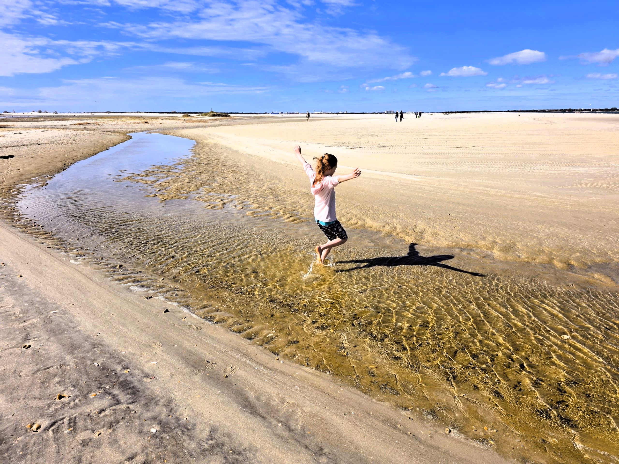young-girl-running-through-water-shackleford-banks-north-carolina
